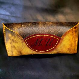 The eyeglass case is made of genuine leather, handmade. Color: Yellow-brown
