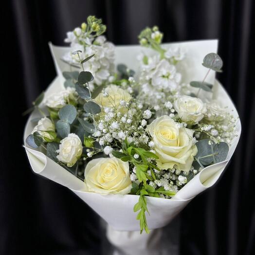 Delicate bouquet of roses and eucalyptus