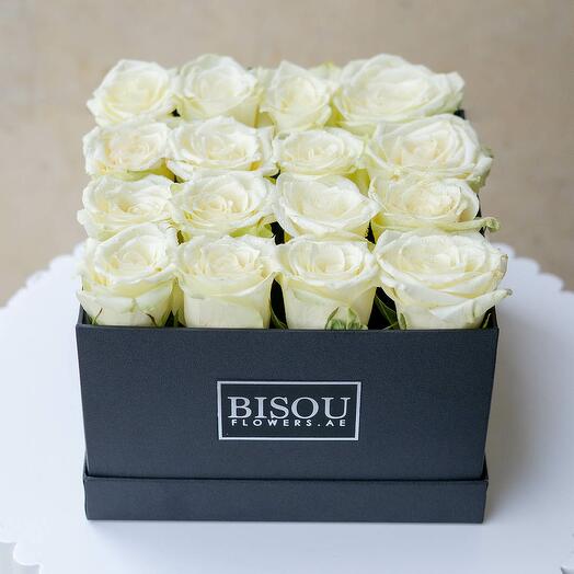 white roses in a box