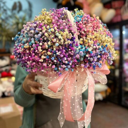 Bouquet of rainbow gypsophila in a basket