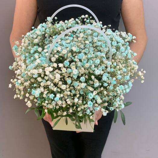 Flowers in a box with a gypsophila Bouquet at the moment