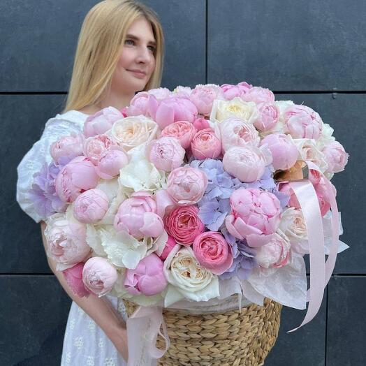 Crate with peonies, hydrangeas and peony-shaped roses