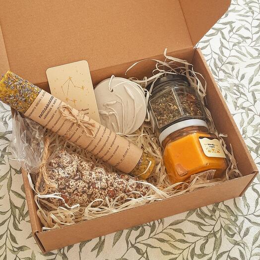 Gift set "Native" with tea, cream honey, nuts, candle with herbs and a pendant with an impression of herbs