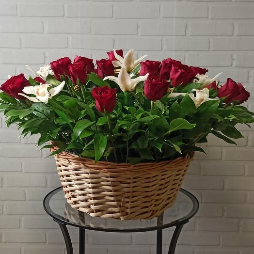 A large basket of gorgeous roses and orchids