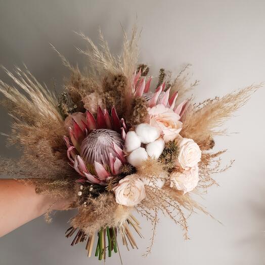 Bridal bouquet with pampas grass, peony rose and protea