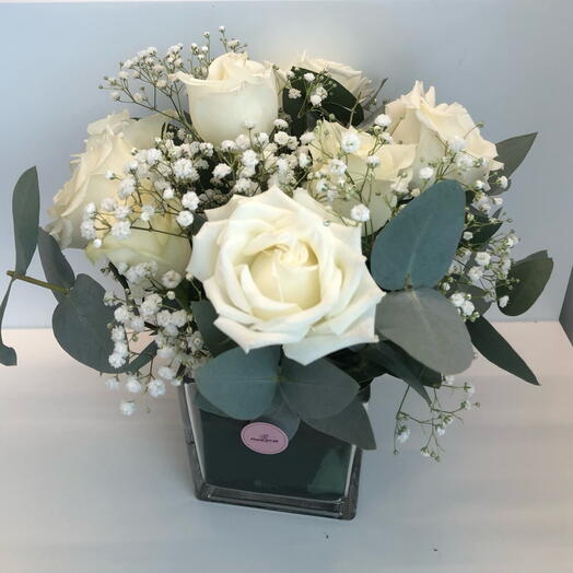 Premium white roses and Eucalyptus in vase
