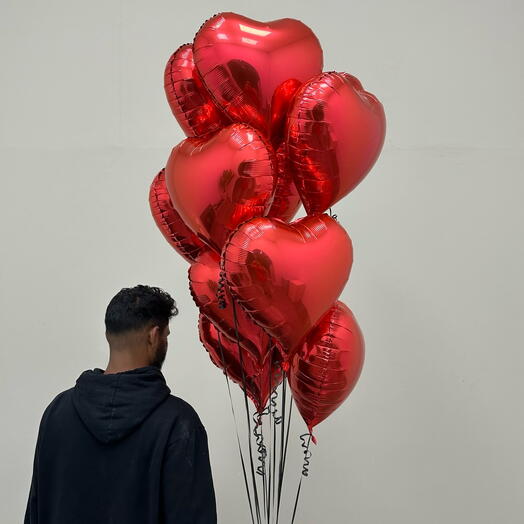 11 red heart balloons