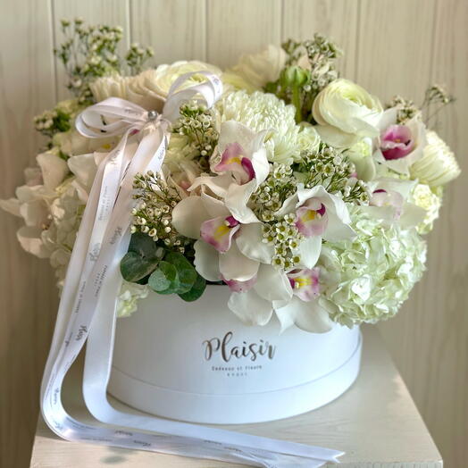 White hatbox with orchids Hydrangeas and roses