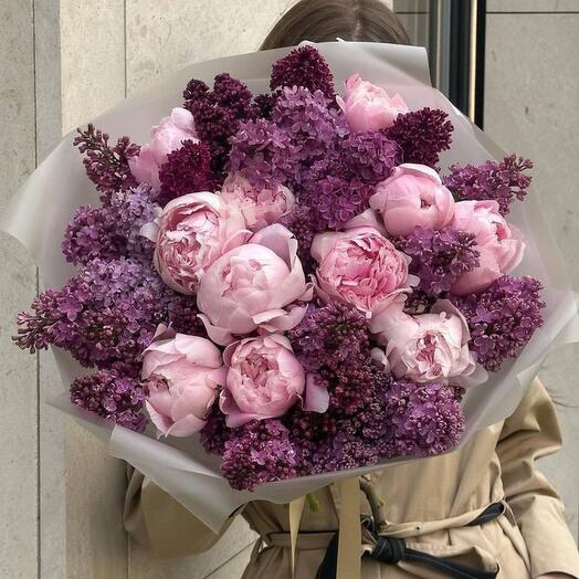 Bouquet of pink peonies and lilacs