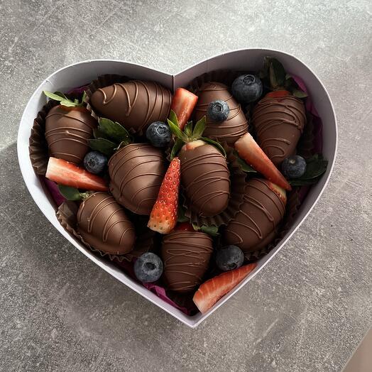 Chocolate-covered strawberries in the shape of a heart