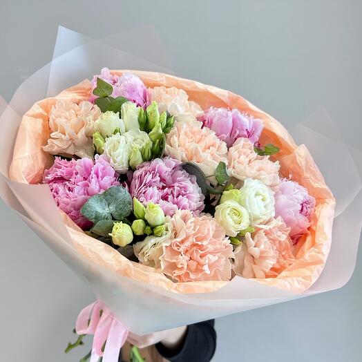 A chic bouquet of plump pink peonies, varietal dianthus and delicate eustoma