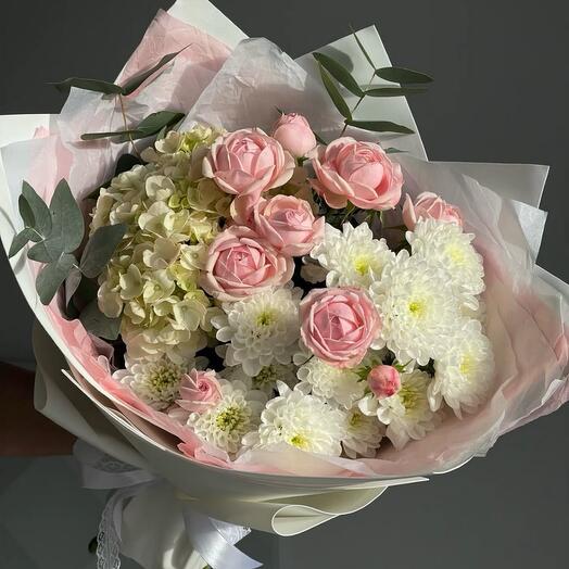 Delicate bouquet with hydrangea, chrysanthemum and bush roses
