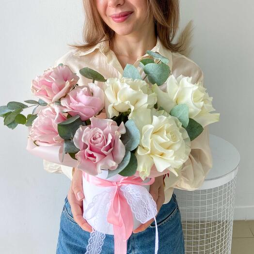 Composition of pink and white French roses with eucalyptus