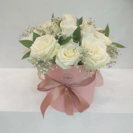 White roses in pink box