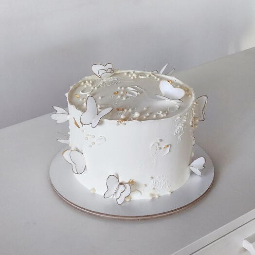 White butter cake with Golden white butterflies Birthday cake