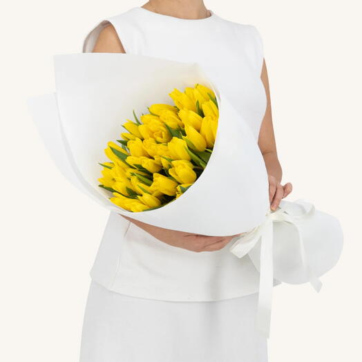 Yellow tulips white wrapping