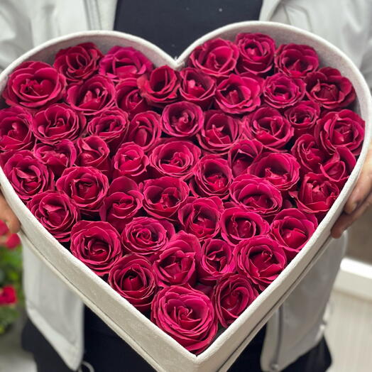 Luxury red roses in heart box
