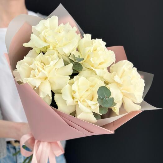 Bouquet of white French roses with eucalyptus in a delicate package