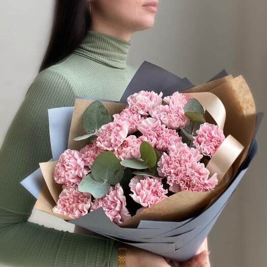 Delicate pink carnations with eucalyptus twigs