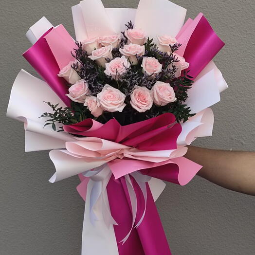 Pretty in pink: Bunch of 15 Stems of Pink Roses in a nice wrapping