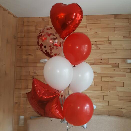 A cloud of red and white balloons