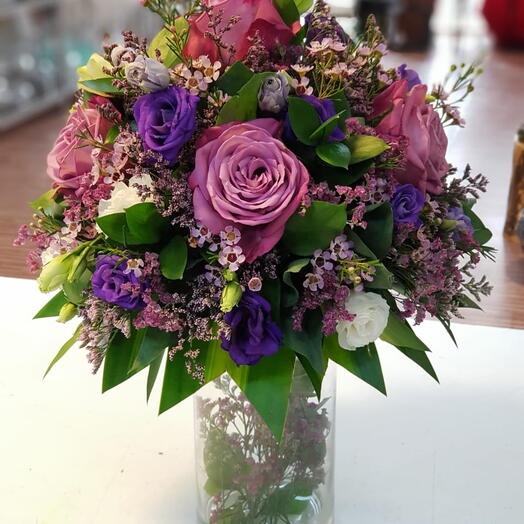 Deep Garden: 12 Purple Roses, 6 Purple Estoma, and 4 Pink Wax Stems in a Vase