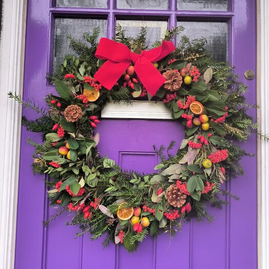 Festive orange and berries wreath