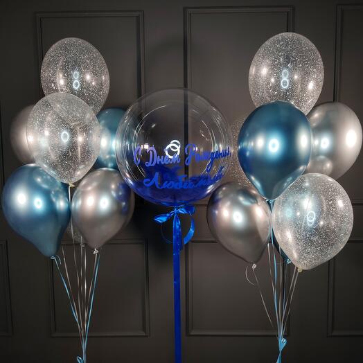 A composition with a bubble with blue feathers and two fountains of balls