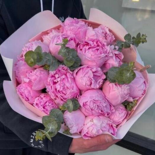 Bouquet of pink peonies and eucalyptus