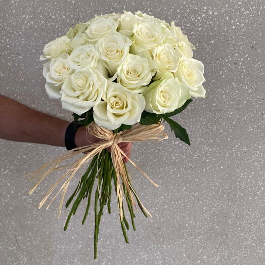 Hand bunch of white roses