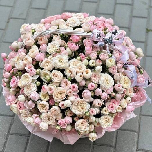 Bouquet of assorted spray peony roses in a basket