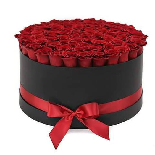 RED ROSES IN A BLACK ROUND BOX