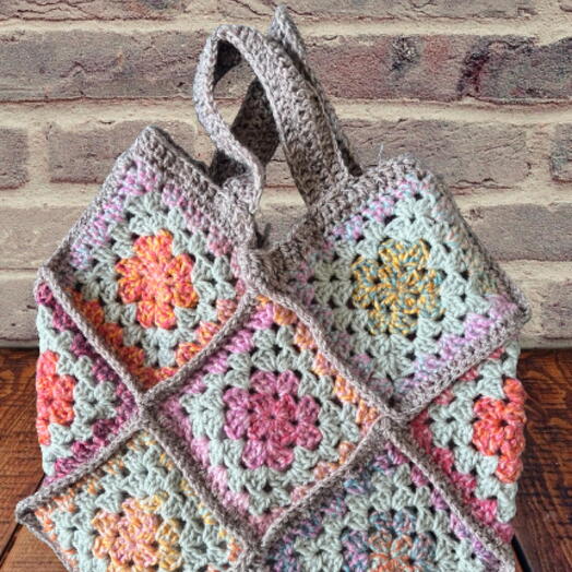 Pastel coloured crocheted bag. Option for short or long straps with a button closure
