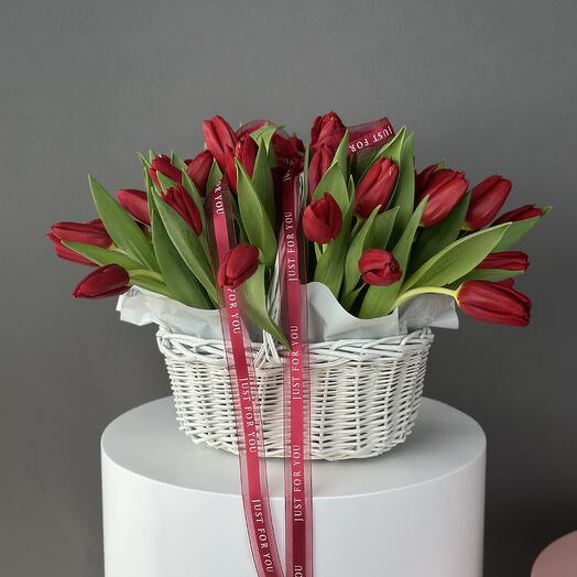 Red tulips in basket