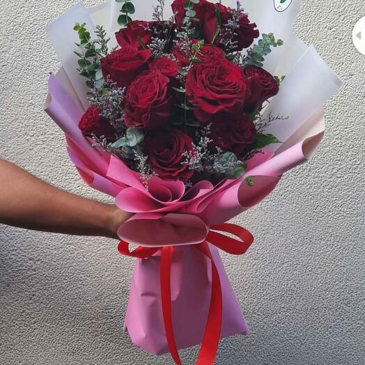 Red roses bouquet with toys