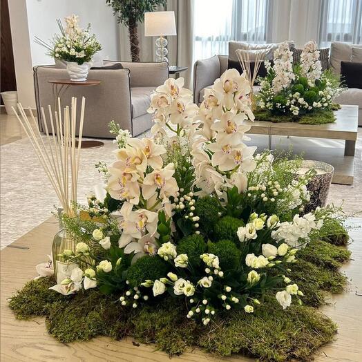 White cymbidium with eustoma green flowers mix home set up