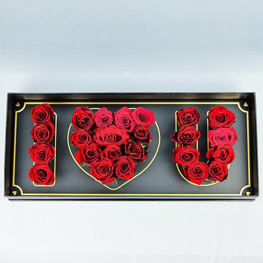 Red roses arranged in an I Love You Box