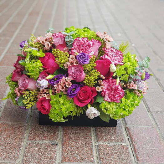 Secret Garden: 4 Green Hydrangeas, 8 Fuchsia Roses, 5 Purple Roses, Purple Double-Color Carnations with Black Box