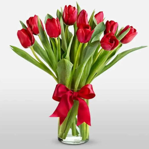 Love Bloom: 10 Red Tulips in Cylinder Vase with Red Ribbon Bow