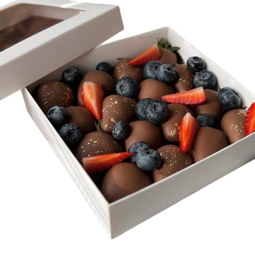 Chocolate covered strawberries with blueberries and strawberry slices