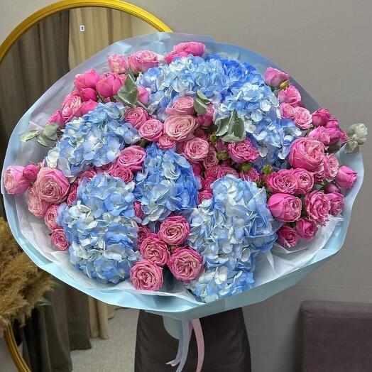 Bouquet of blue hydrangeas, spray peony roses and eucalyptus