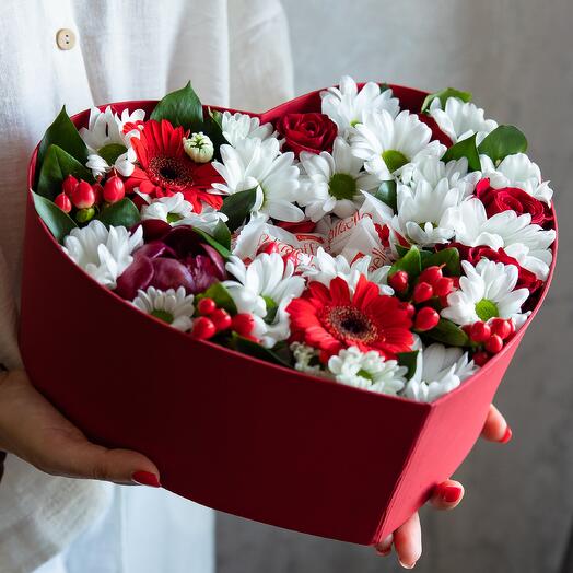 The most delicate bouquet of chrysanthemums, gerberas and hakuna roses in a heart box