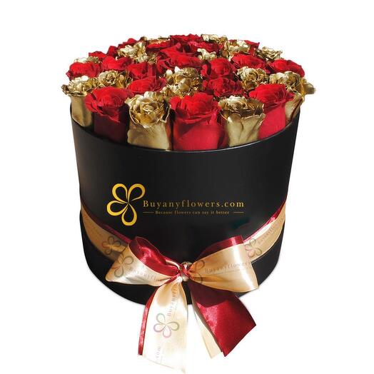 Gold and Red Roses Arrangement in Black Round Box