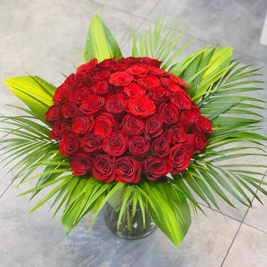 RED ROSES IN A VASE