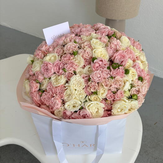 A mix of bushy white and pink roses