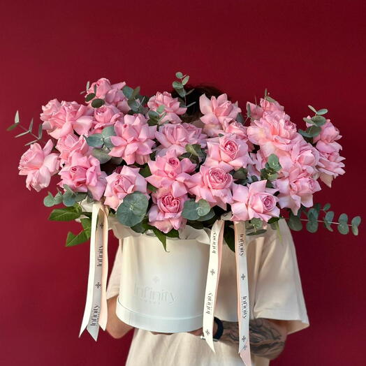 French roses with eucalyptus in box