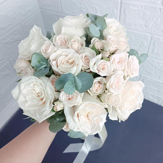 Bouquet of peony roses with eucalyptus