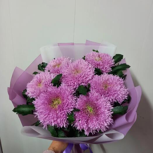 A box with a rose bush and marshmallows