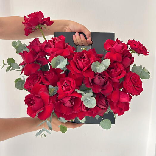 Red roses in a handle box