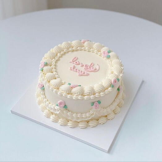 White buttercream with small flower cake